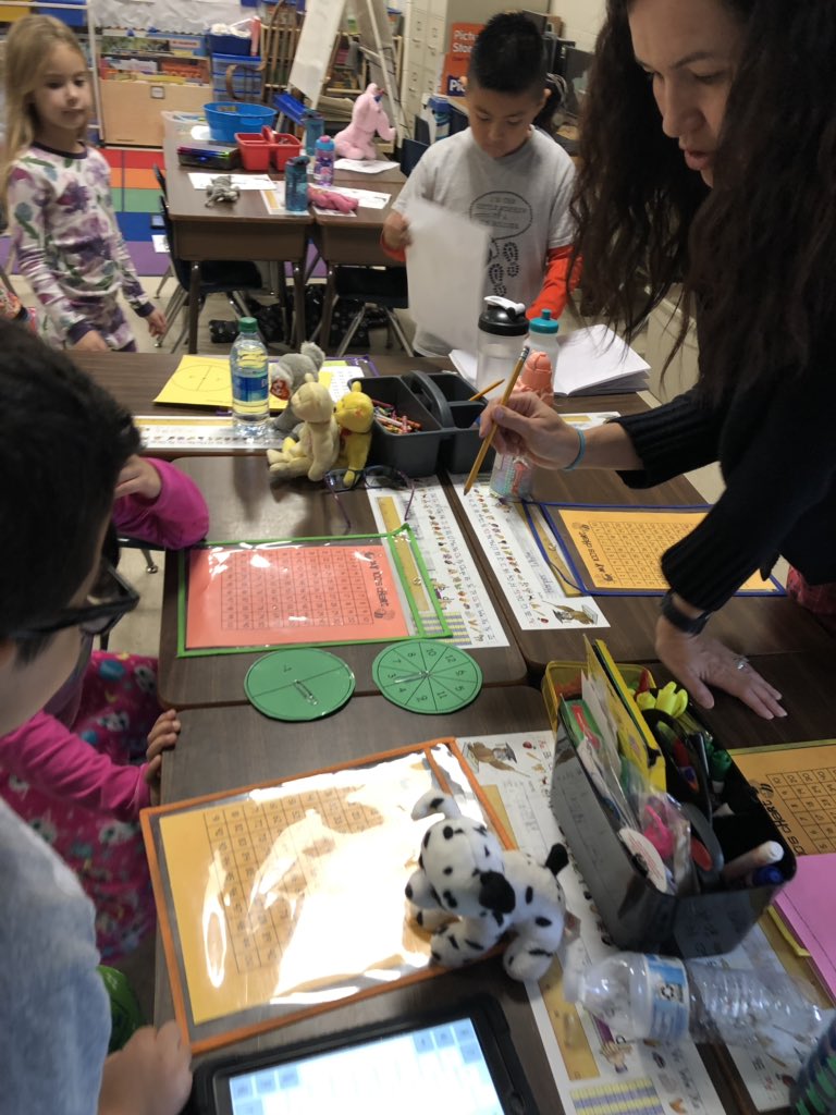 Mrs. Ashworth is working with children using fun math games! #oges15daychallenge <a href="/OGESeagles/">Oak Grove Elementary School</a> @mgrant_ils <a href="/CherokeeSchools/">Cherokee Co. Schools</a>