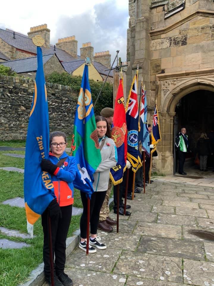 Daisy &amp; Skye (1st Holy Island Rangers) flag bearing for the Remembrance Sunday service at St Cybi’s this morning. We also joined the parade down to the cenotaph for 11am. #LestWeForget <a href="/GuidingCymru/">Girlguiding Cymru 🏴󠁧󠁢󠁷󠁬󠁳󠁿</a> <a href="/Girlguiding/">Girlguiding</a>