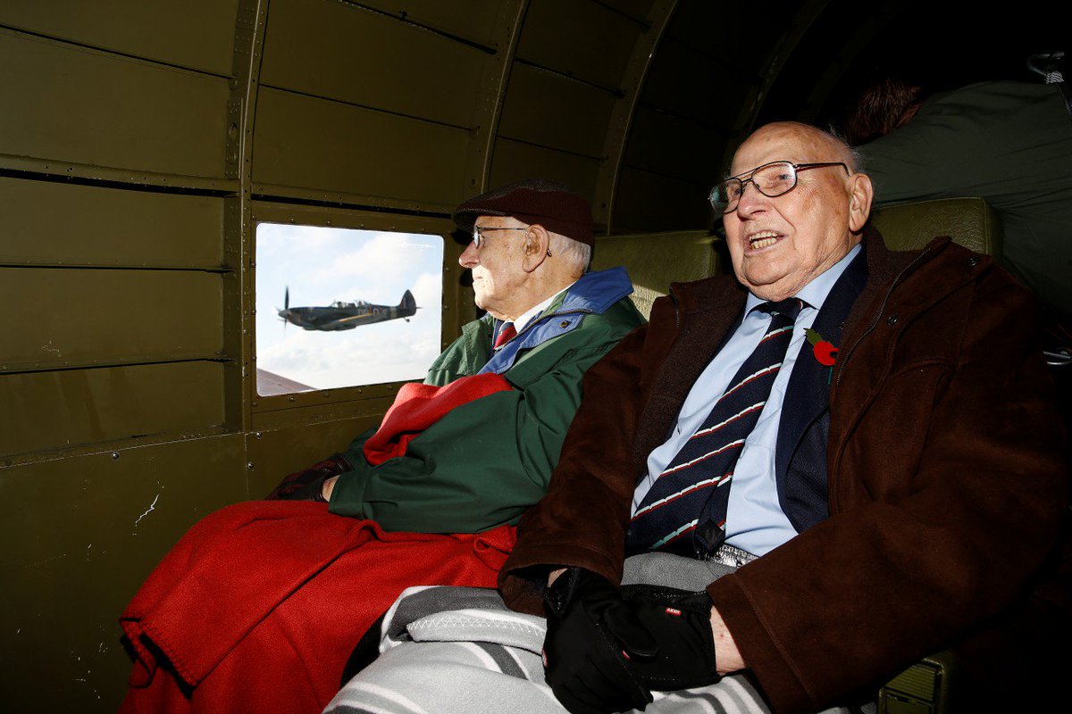 MetroUK's tweet photo. World War 2 veterans Roy Briggs (left) and George Prichard are onboard as two Dakotas drop 750,000 poppies over the White Cliffs of Dover on #ArmisticeDay https://t.co/EQKBFeNk1W