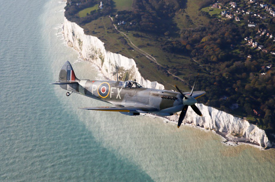 MetroUK's tweet photo. World War 2 veterans Roy Briggs (left) and George Prichard are onboard as two Dakotas drop 750,000 poppies over the White Cliffs of Dover on #ArmisticeDay https://t.co/EQKBFeNk1W