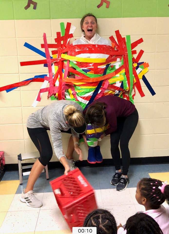 lisagarosi's tweet photo. Late posting... Friday was so fun! Top classes for raising money for the fun run.. taped to the wall with @mstoneCWES and @MsBowensClass ... @CogburnWoodsES and I said I would not stay on the wall...@CogburnWoodsPTO https://t.co/MLrTi4ukNi