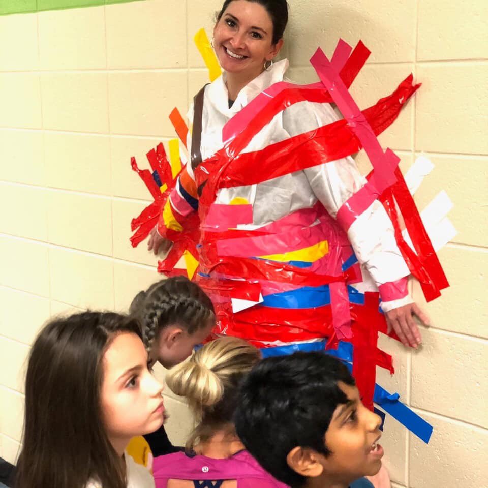 lisagarosi's tweet photo. Late posting... Friday was so fun! Top classes for raising money for the fun run.. taped to the wall with @mstoneCWES and @MsBowensClass ... @CogburnWoodsES and I said I would not stay on the wall...@CogburnWoodsPTO https://t.co/MLrTi4ukNi