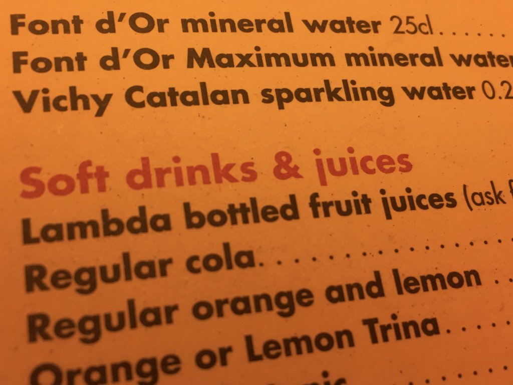 A menu with “lambda bottled fruit juices”.