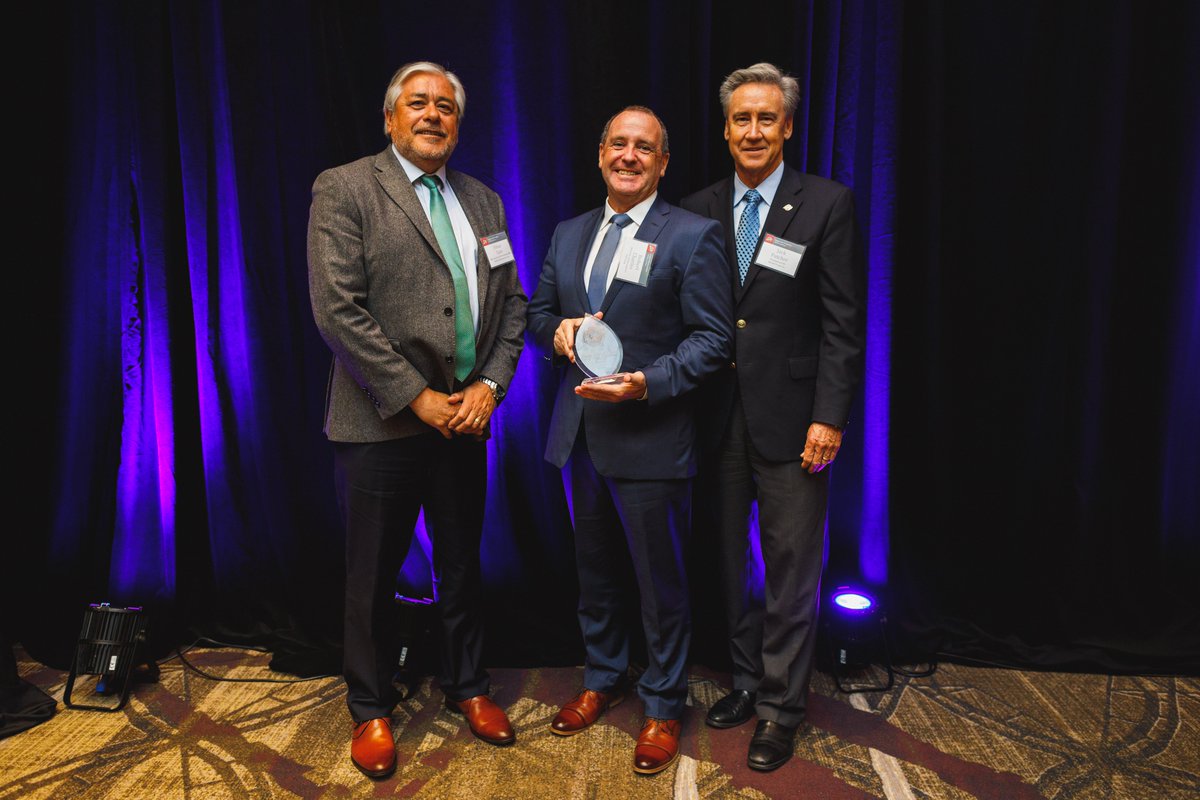 Robert Charles, Head of Americas, Toll Global Logistics, on stage representing the AU Amrun Project team collecting the award.