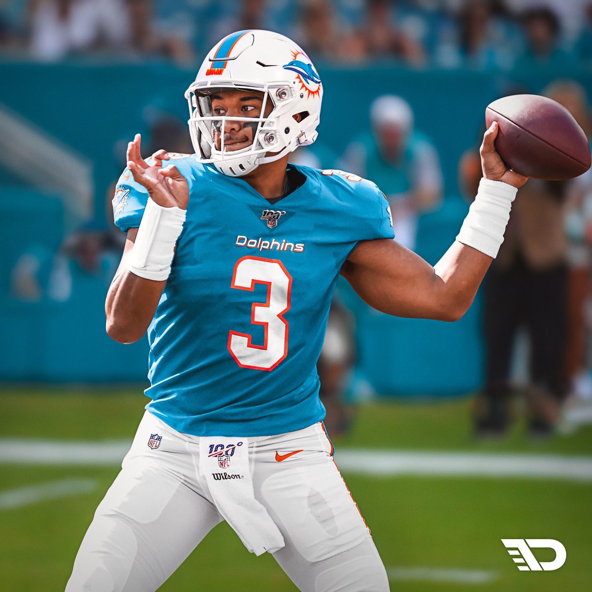 tua in a dolphins jersey
