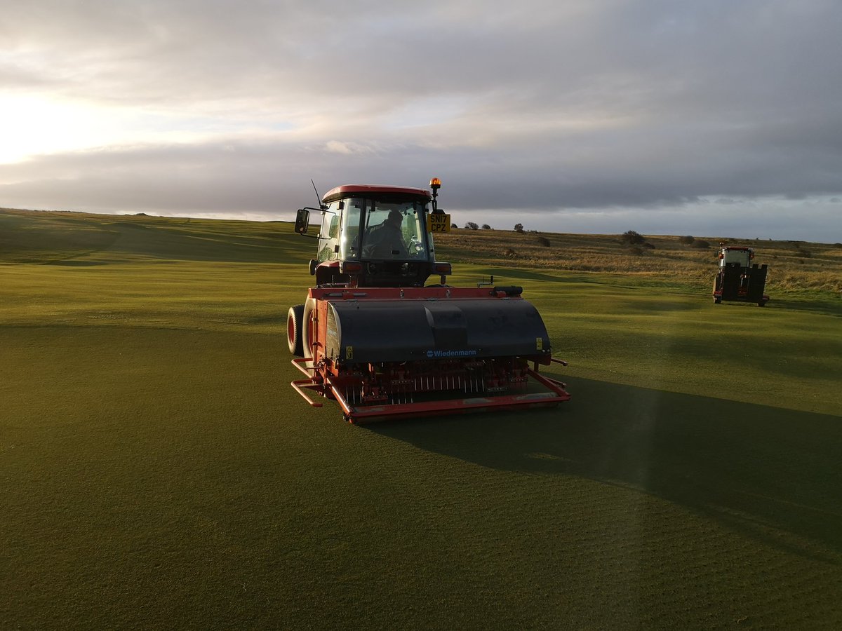 PHay01's tweet photo. V-Drain #greens this morning, 8mm tines. #minimumdisruption @GullaneGolfClub @WiedenmannUK @KubotaUK #terraspike @cooney1987 https://t.co/Y2X8Twyxlm