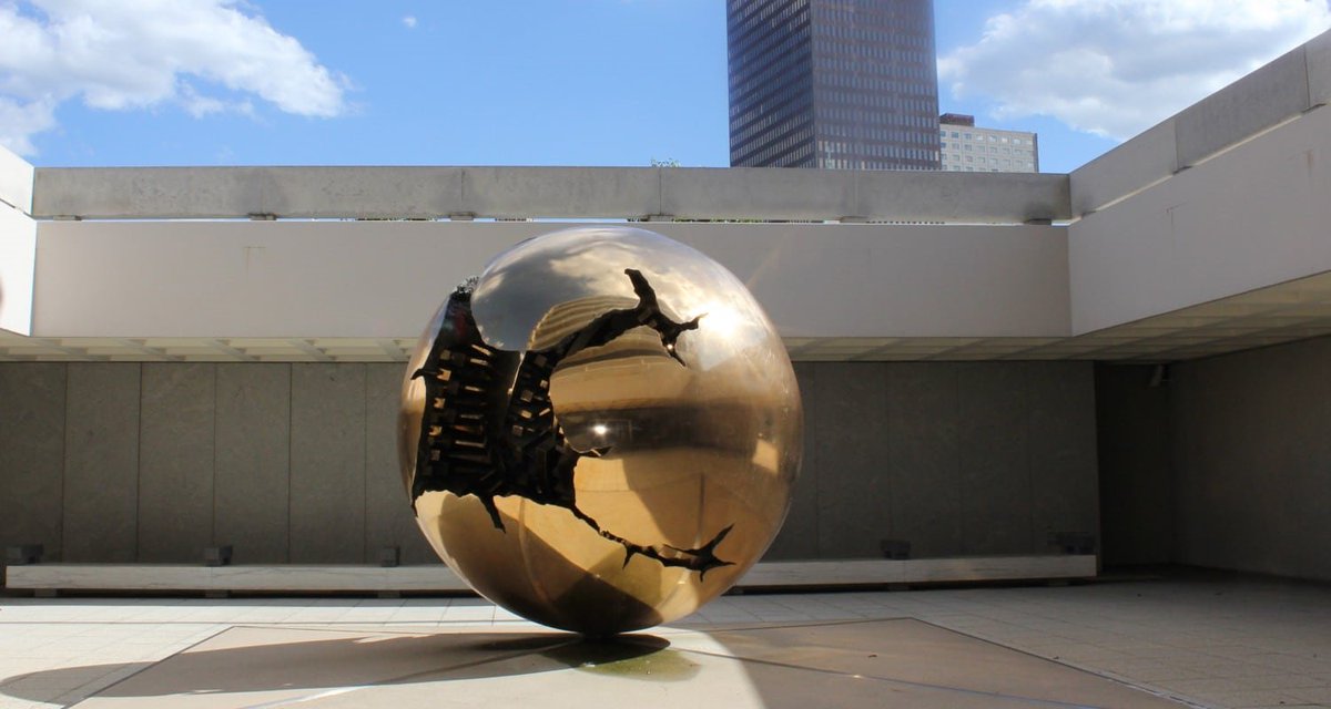 Sculptures like this are collectors. They act like an open mouth. The walls in behind reflect any frequency that went around the mouth back to it.The paved area under it designates the recharge area.