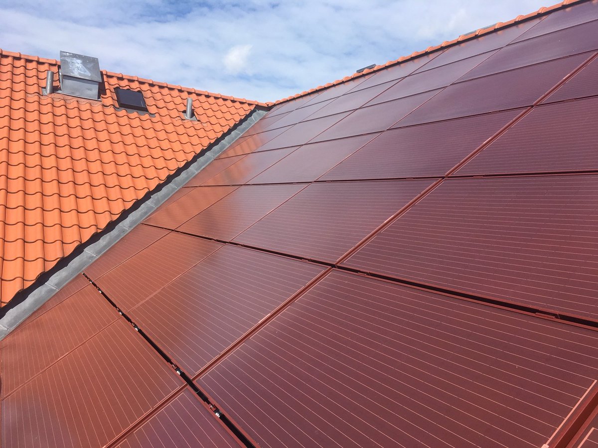 Sunerg_Solar's tweet photo. #BIPVsolution Customized rooftop system with red monocrystalline modules - Denmark https://t.co/lHJpBogoNg