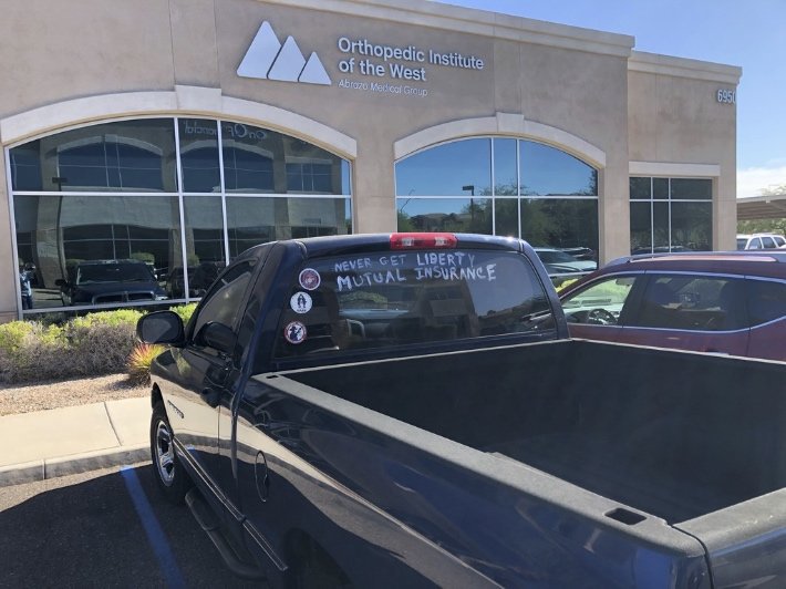 I was going for my knee surgery follow-up when there was lady coming out getting into this pick-up truck. Question her about the sign on the rear window. Her reply was @LibertyMutual Insurance had not paid there auto claim now into 18 weeks. So I took some pics.