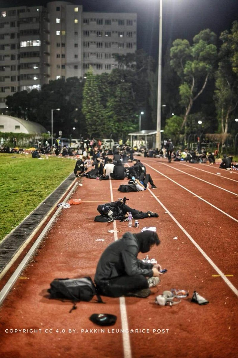 hoccgoomusic's tweet photo. It is 2am and Chinese University students are exhausted from the full day fight. 

Some are taking rest in the courtyard, but most are keeping an eye open, still cautious for any sudden police attacks.

#HongKong 
#StandwithHongKong
#HKPoliceTerrorism https://t.co/lQtaAGTv9i