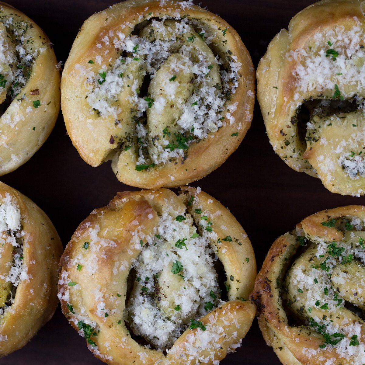 Roll up to our place this Thanksgiving for warm and buttery house-made sourdough garlic and parmesan rolls, crafted with love by pastry chef Jackie Suter. (Photo credit: Nicole Hennessy Photography)