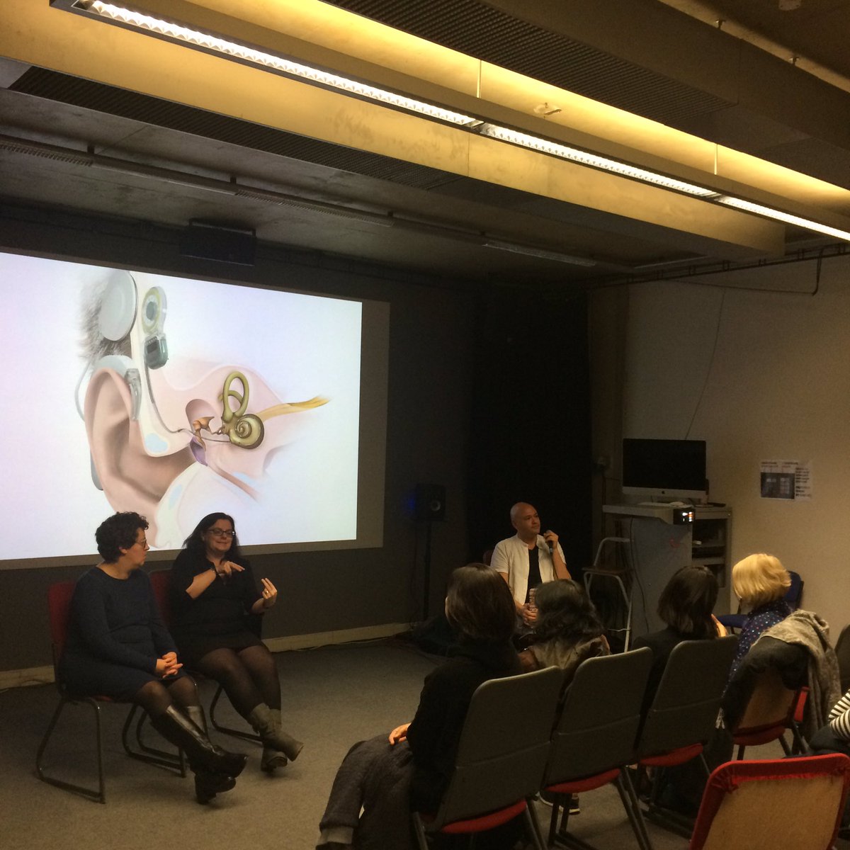 Discussing cochlear implants with <a href="/ttlalim/">Tom</a> and artist Seohye Lee (and the audience!) right now for Deaf Gain: exploring sound, technology and hearing diversity.
<a href="/CRiSAP2/">Creative Research in Sound Arts Practice</a> <a href="/ActionOnHearing/">We're now RNID</a> <a href="/V_and_A/">V&A</a> <a href="/UAL/">University of the Arts London</a> <a href="/ResearchLCC/">LCC Research</a> #Deaf #BSL <a href="/DeafAction/">Deaf Action</a> <a href="/BritishDeafNews/">British Deaf News</a> #SignLanguage #HearingLoss