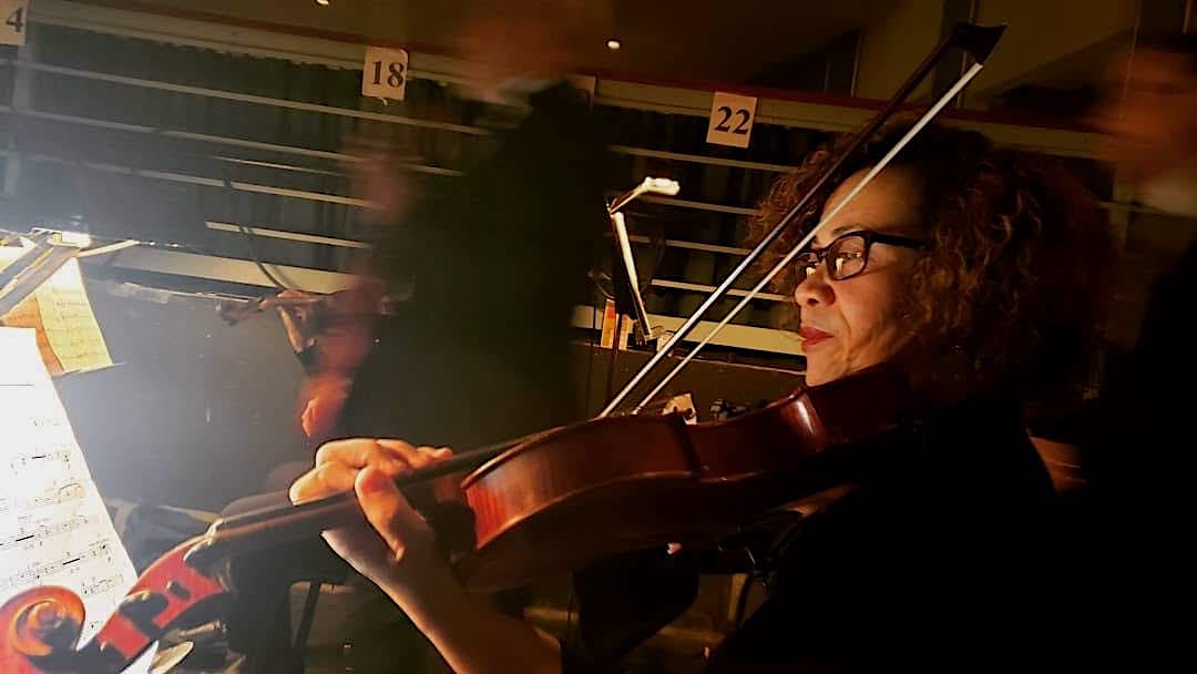 VSOMusicians's tweet photo. Our Principal Violist, Beverly Baker, getting ready in the pit for Il Postino. If you're in Norfolk, catch the opera tonight at Harrison Opera House at 7:30pm. #viola #opera #viewfromthepit #orchestra @VASymphony https://t.co/TNUFYJrqse