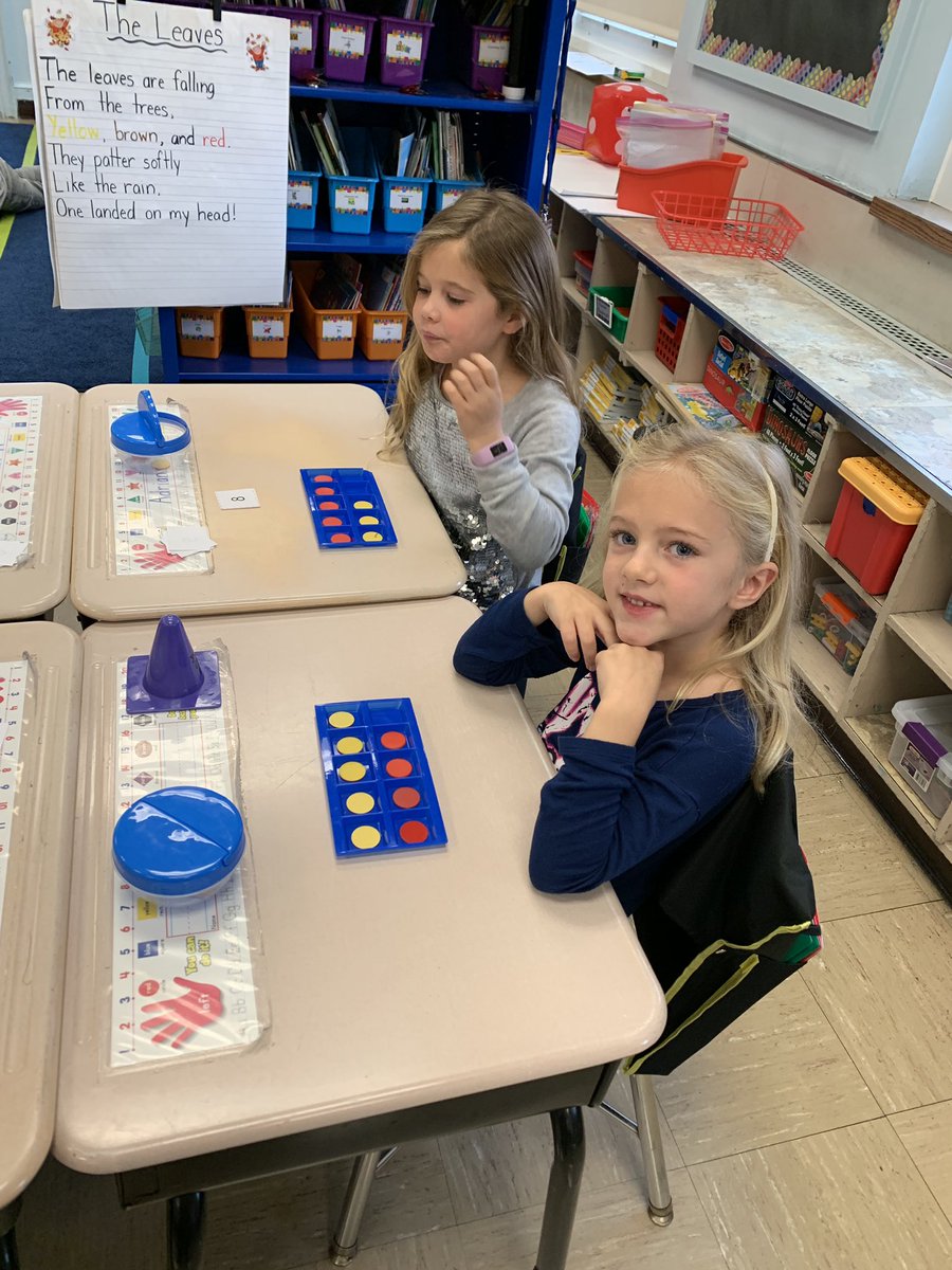 Having fun playing a math game to practice “1 more than..”!