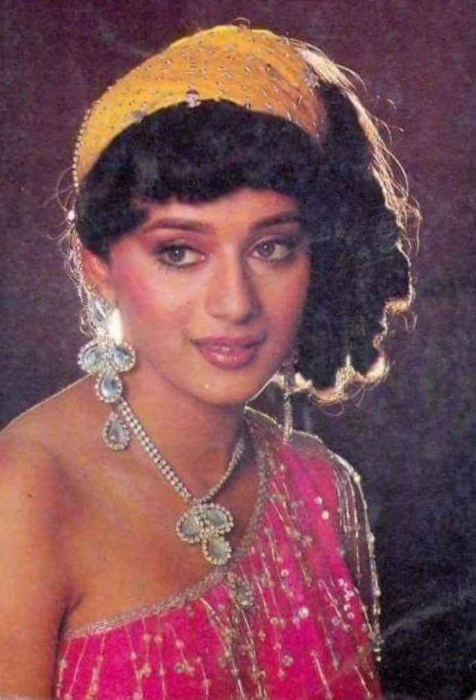 CinemaForensic's tweet photo. The glittery pink dress, the yellow bandana, the unique Numerical-song and an evergreen beauty dancing to it! Iconic. #31YearsOfTezaab https://t.co/d9kmbYBrQI
