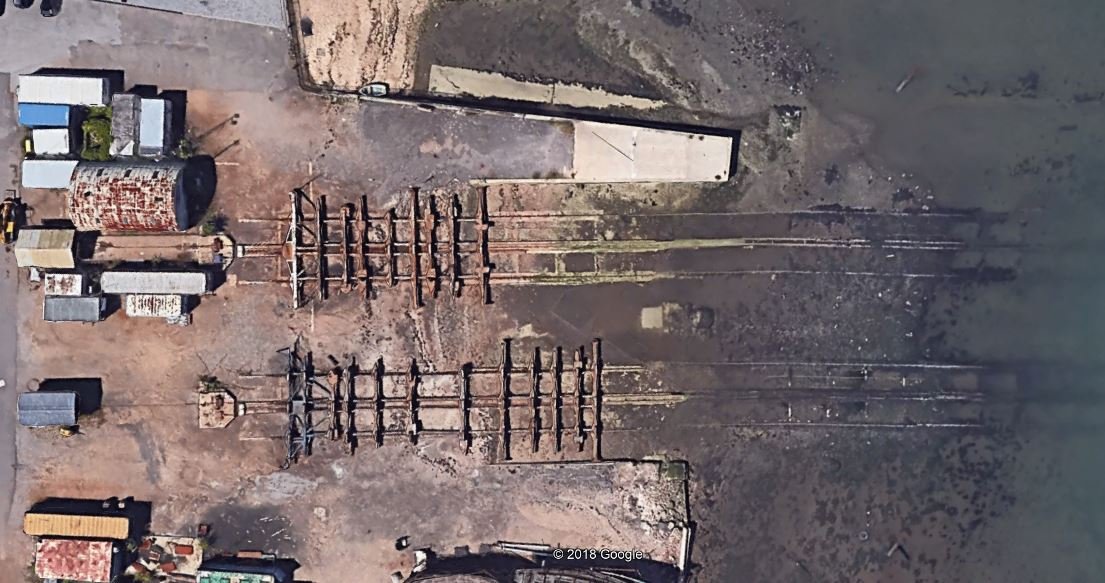 I was very excited recently when I identified these slips in Marchwood. They're Landing Craft repair slips, built in advance of D-Day and vital for  #EmbarkingtheDDayArmada. And perfectly preserved, even the metal cradles are still there! Unfortunately... (short thread)