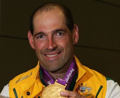 Kieran Modra holds a gold medal won during London 2012