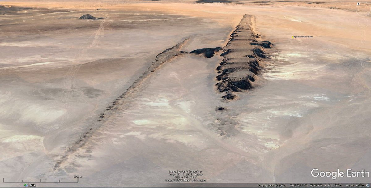 The 2 large parallel dykes are oriented NE-SW and are ~2.5km apart.The larger dyke is ~23km long and ~1.5km wide at its widest part. The smaller dyke is ~13km long and ~800m wide at widest part.