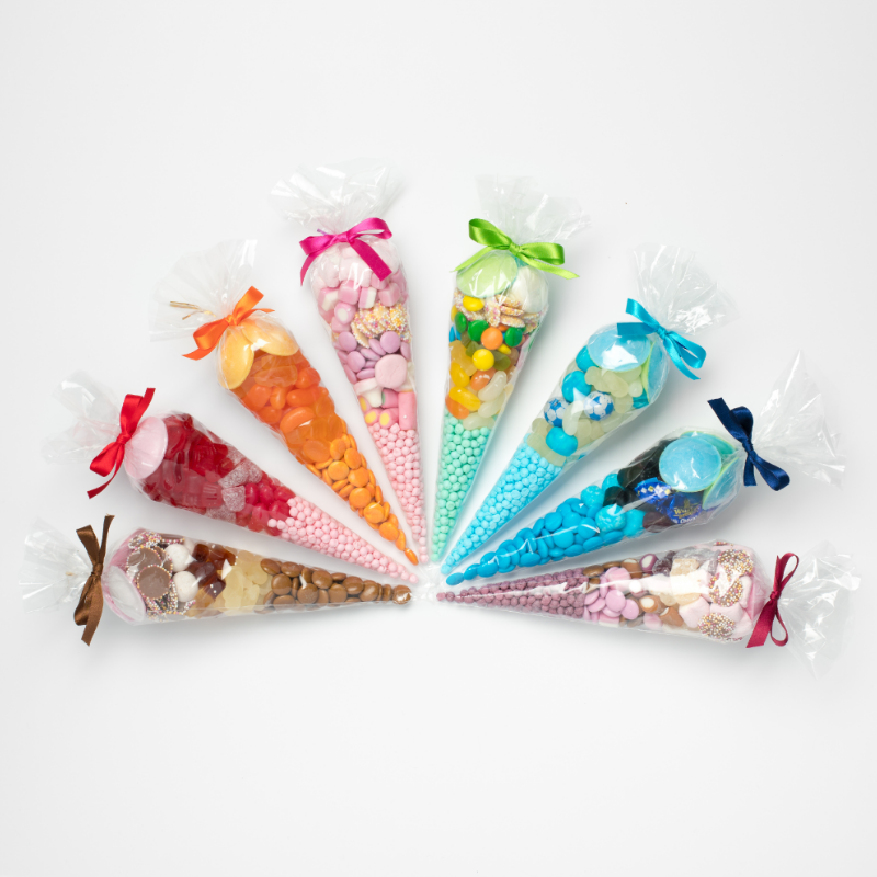 sheredelights's tweet photo. Our colour themed party cones are a treat for your eyes as well as your taste buds.  Choose from 8 different colours to match your occasion ~ perfect for the upcoming festive season! Available online and in both our Godalming and Shere shops. 🎉
https://t.co/J13b9UlZk2 

#sweets https://t.co/kOimcqS344