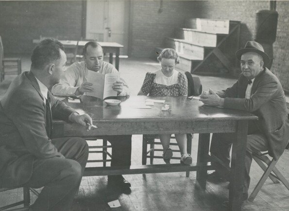 Polling place we believe was located at the Kernersville School gym,1940's. We know the second man from the left is Fred Vance and the man on the right wearing the hat is Ad Linville. We are still trying to identify the other two in the picture. Do you recognize anyone here?