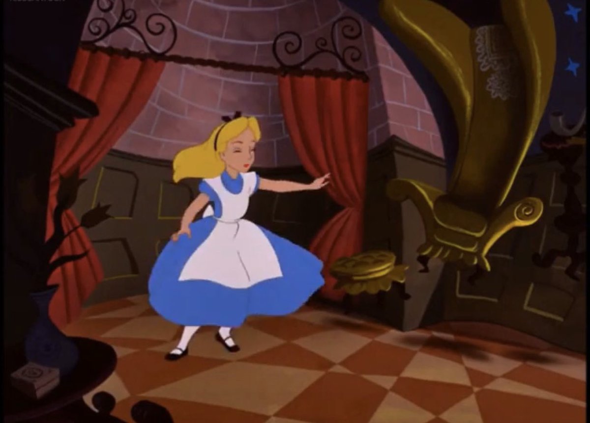 In Alice in Wonderland (which is a dream), Alice chases the white rabbit into a hole and falls down a tunnel into a room with a black and white checkered floor.