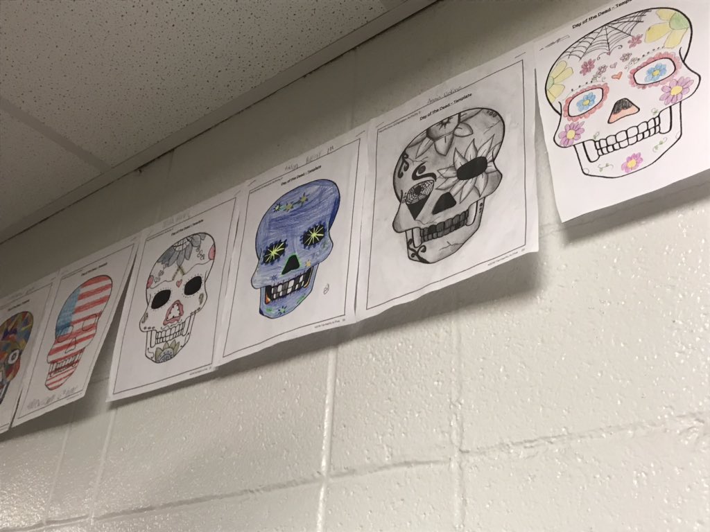 ReadingWithBird's tweet photo. I’m super behind schedule in posting but here are the Calaveras we decorated in honor of Lupe and Day of the Dead with our #grafrontdesk by @kellyyanghk!!  #DayoftheDead #diadelosmuertos https://t.co/G7BdJY9LPT