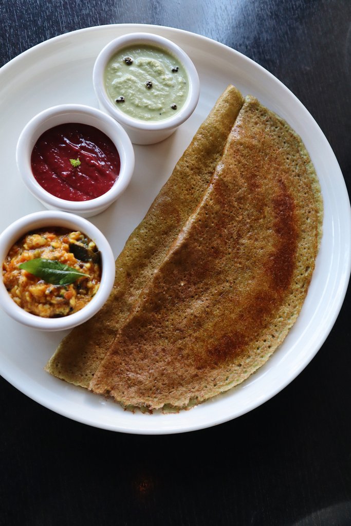 Intricately built, our sprouted seven grain soft dosa comes with a complex, savory vegetable relish and a homemade spiced red plum chutney.