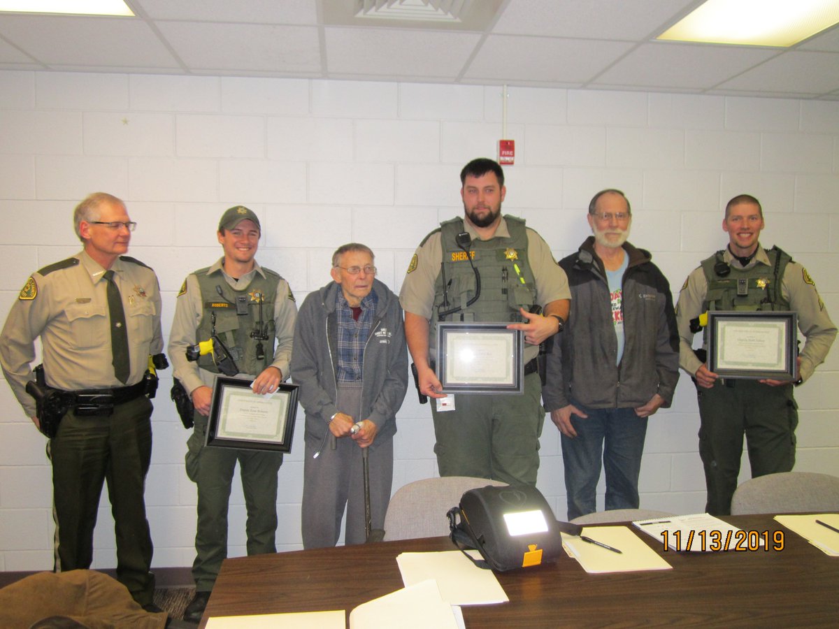 OCSOIowa's tweet photo. Sergeant Matt Julius and Deputies Zane Roberts and Tyler Bos were acknowledged for their roles in providing vital life saving measures to Sibley residents Gary Iedema and Charles Klaassen. https://t.co/Q4NeB3XcI4