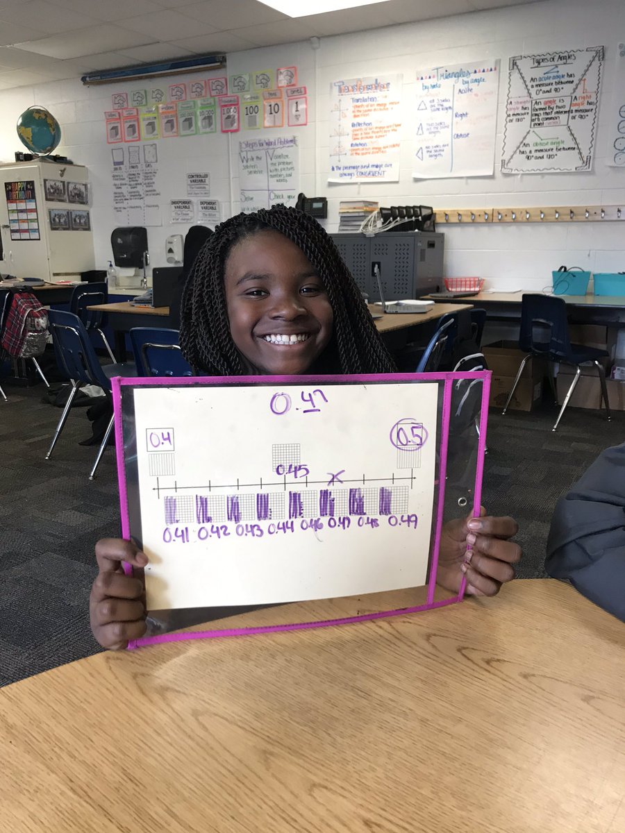 msknorton's tweet photo. All happy smiles practicing how to round decimals to the nearest tenth on our place value number line! https://t.co/FO7ZZ5Pd6S