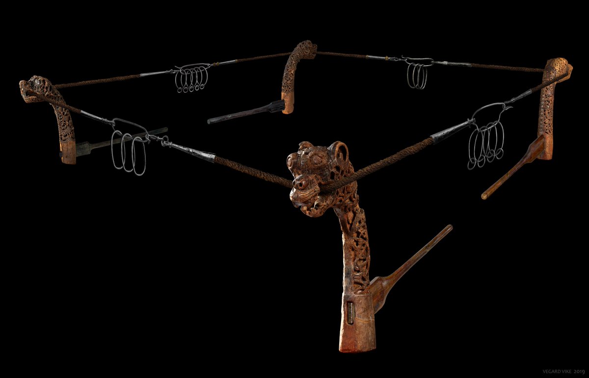 Each of the rattles was attached by a rope to its metal hook. In addition the rattle-rope passed through the mouth of the associated animal head post.