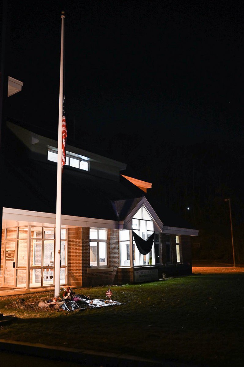 agreenphotog's tweet photo. A growing memorial at Worcester’s McKeon Road Fire Station as black bunting covers the windows and a flag rests at half-staff @telegramdotcom https://t.co/InRpvAF23v