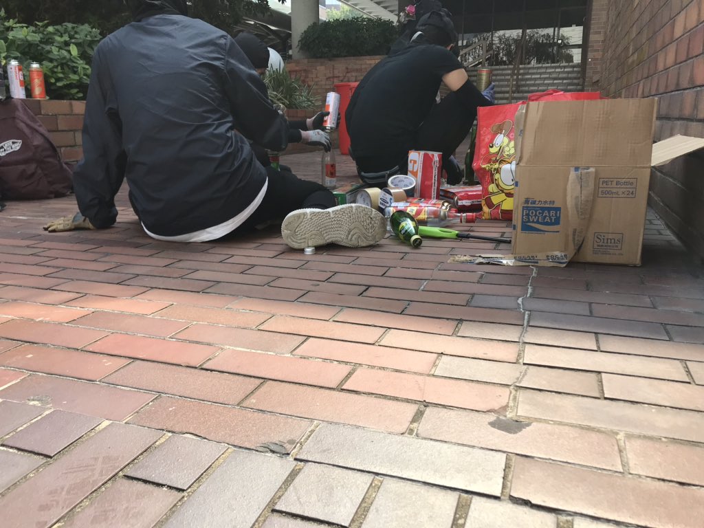 PolyU is a hive of activity. The whole campus is abuzz with students busily preparing defences, readying Molotov cocktails, distributing supplies, staffing the first aid stations, making posters, and scouting for police activity. They’re getting stuck in for a protracted siege.