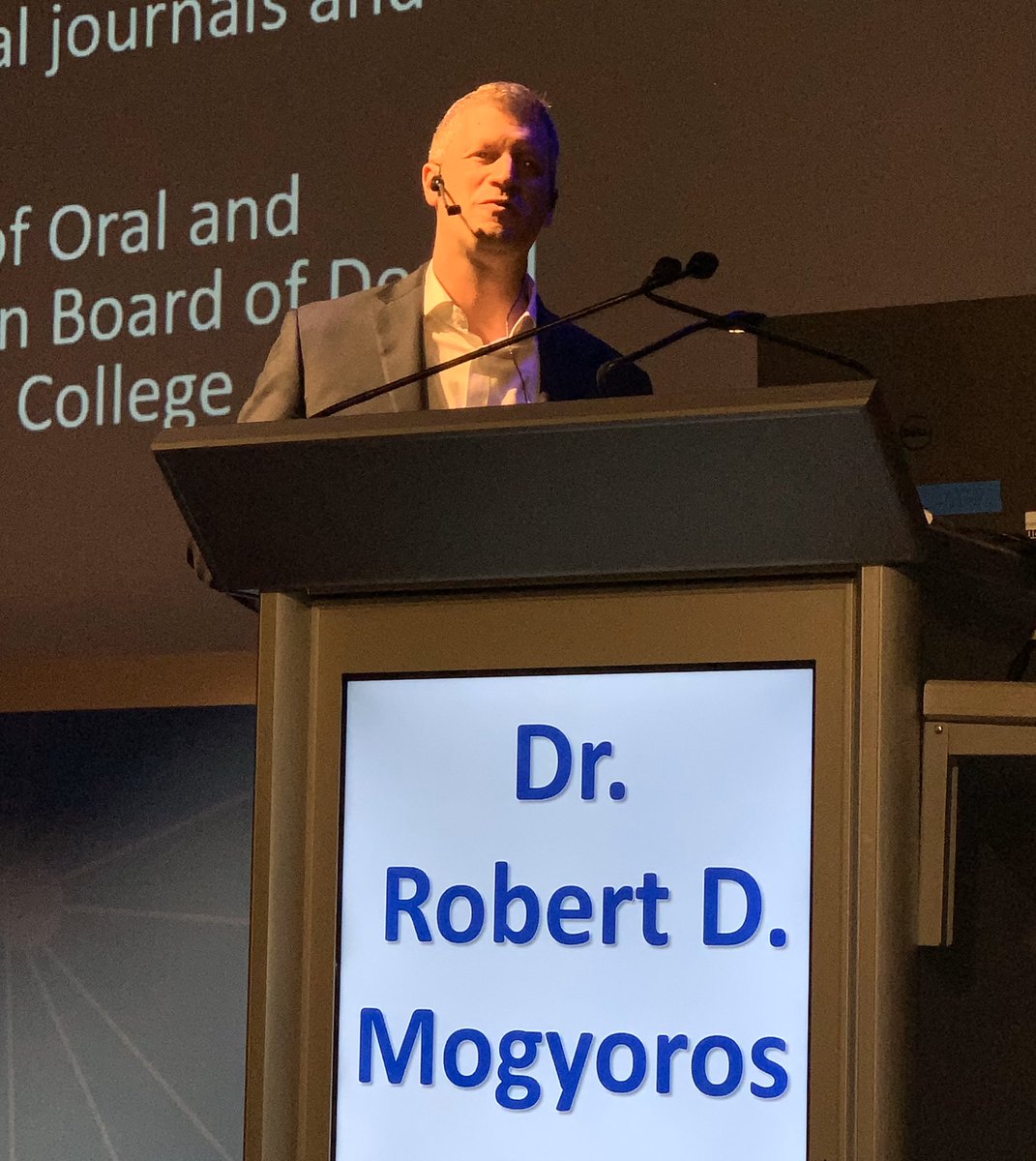 osseodent's tweet photo. Dr Robert Mogyoros (Maxilofacial surgeon) at the Augma AiS presenting his lecture “New Iseas for Bone Cement” #osseodent #osseograft #augmabio #augmared #augmablue #bondapatite #3dbond https://t.co/6pMFTMuHBw