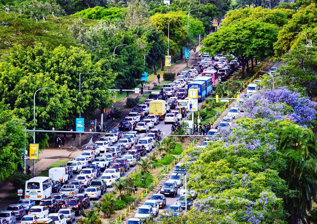 mwarv's tweet photo. An aerial view of Nairobi traffic with a dash of  #JacarandaPropaganda 

 #Nairobi #Nairobae https://t.co/sBjSeFTe1X