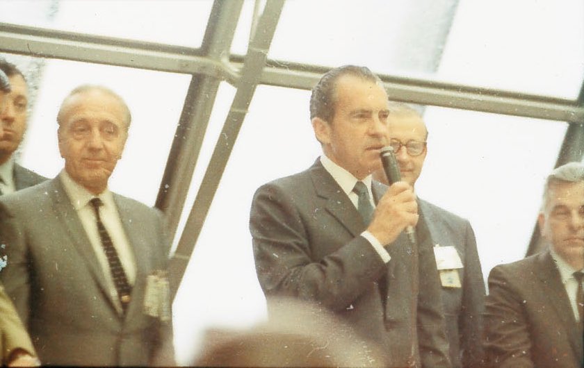 After Apollo 12 is safely in orbit, President Nixon addresses the Launch Control Center's staff accompanied by KSC director Kurt Debus and Tom Paine. Nixon: "America, the United States, is first in space."12/