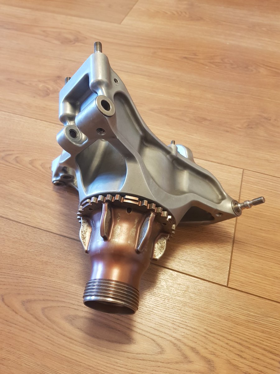 This part connects the wheel, brake and suspension. The silver upright is machined Aluminium, the hub axle is Titanium. It weighs 3.2kg