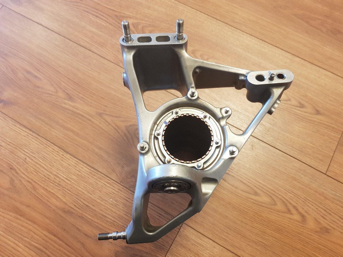 This part connects the wheel, brake and suspension. The silver upright is machined Aluminium, the hub axle is Titanium. It weighs 3.2kg