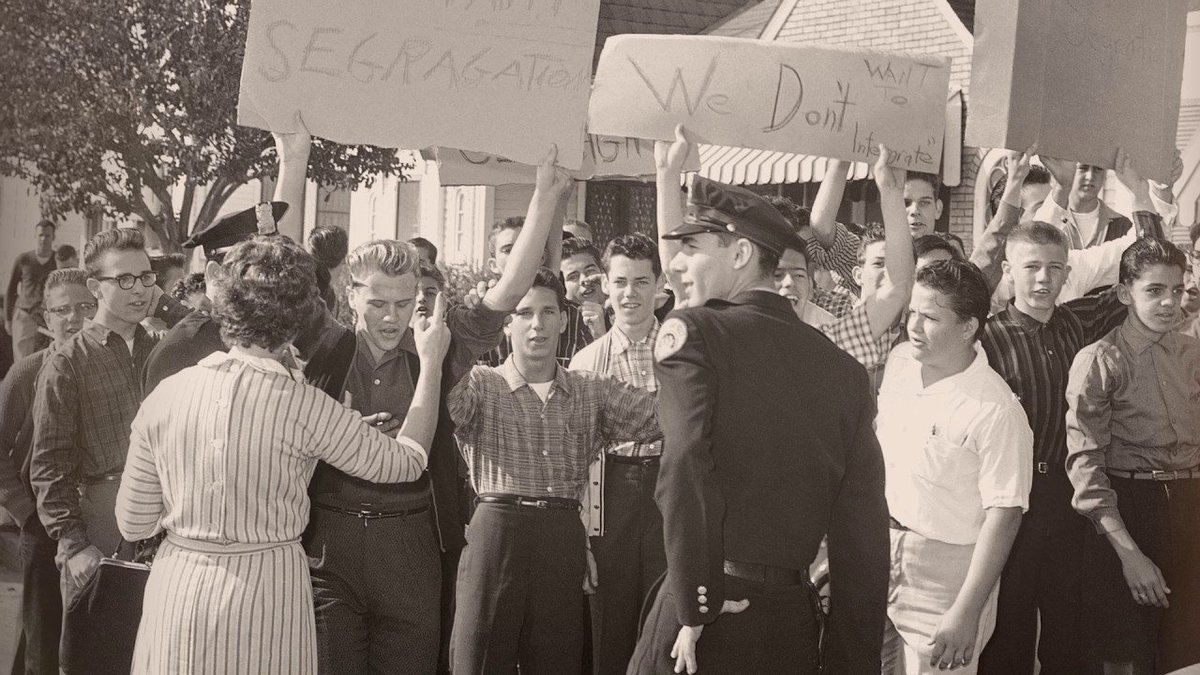 The school district required an entrance exam for Black students, and Ruby was one of five students who passed. For the entire school year, she was escorted to class by federal marshals and braved mobs of people screaming slurs at her.