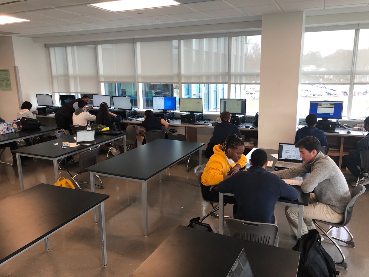 Our teammates working on the website, while others work on the automated swing structure.