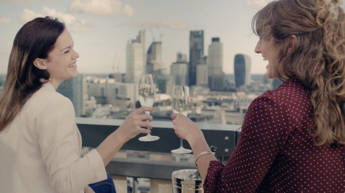 6/And finally, let's refresh that all-important lipstick and finish off the workday with some bubbly and a girlfriend on the roof. Ahh.