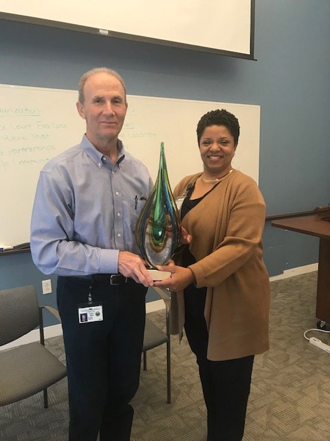 MeckClerk's tweet photo. Clerk Chinn-Gary met with her supervisory staff at the last Clerk Management Meeting of the year. At the meeting, the next recipient of the Pass the Torch Leadership Award was recognized. Assistant Clerk Lakeshia Williams passed the "torch" to Assistant Clerk Grant Harris! https://t.co/udGXFRVLkd