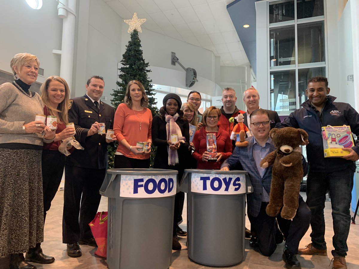 TownOfAjax's tweet photo. #AjaxCouncil, partners and staff on hand at Town Hall to kick off the @mayor_collier &amp; Council annual food &amp; toy drive! 

Drop off non-perishable food and new, unwrapped toys 🧸 by December 16! 

More info: https://t.co/fOV8SYPQEP https://t.co/QZWOpPN7Jt