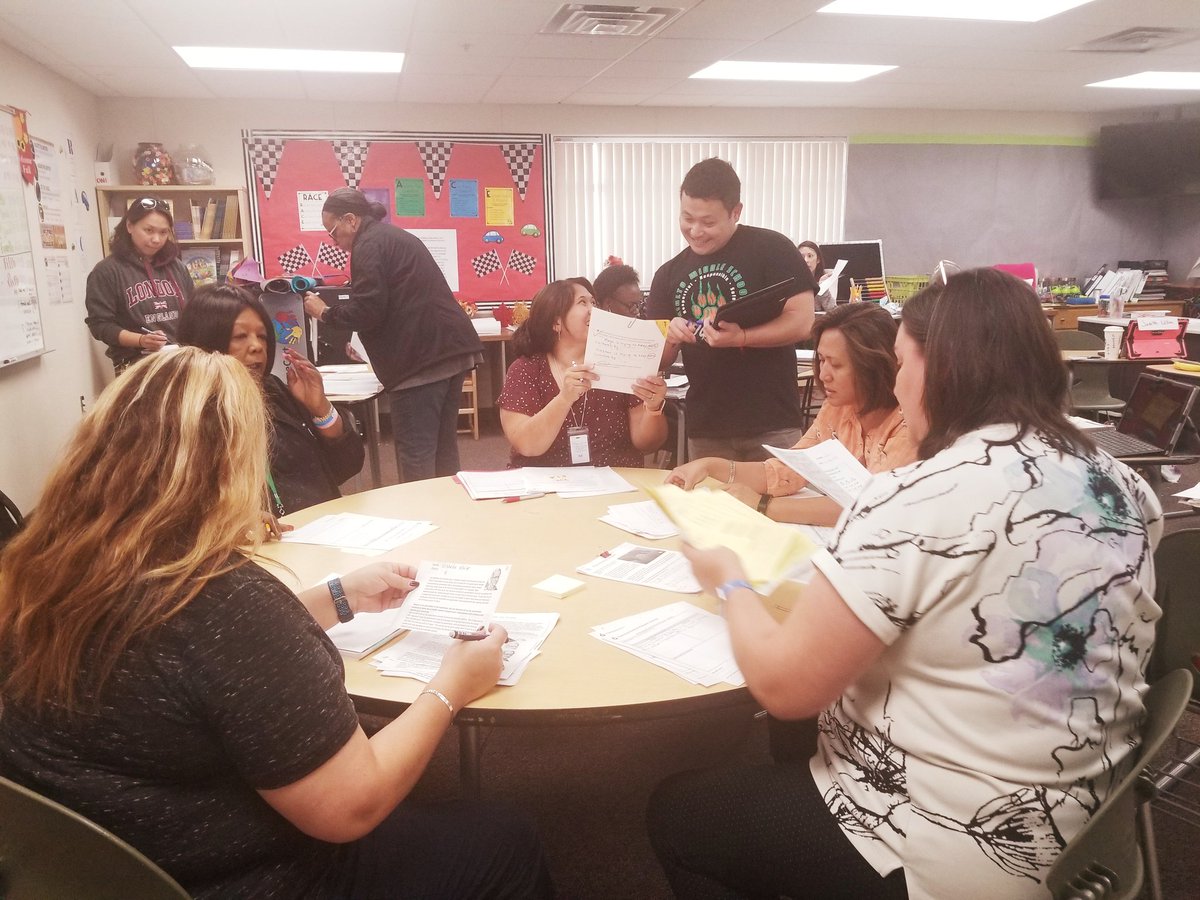 The Rialto M.S. SLT is Analyzing Student Work utilizing the R.A.C.E. strategy. The room is filled with engagement and #collaboration. #Deeplearning @go_InnovateED