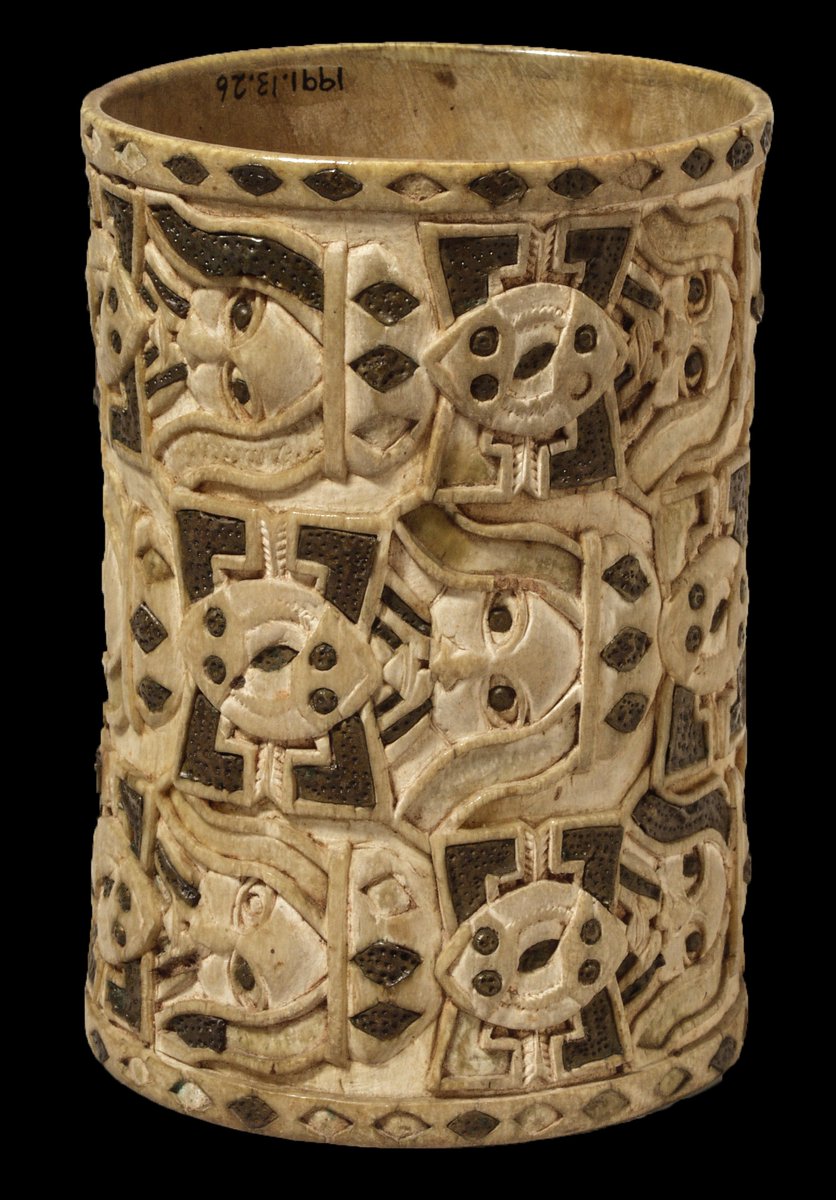 Ivory armlet inlaid with brass and carved with mudfish and the heads of Europeans, looted in 1897  #BeninDisplays