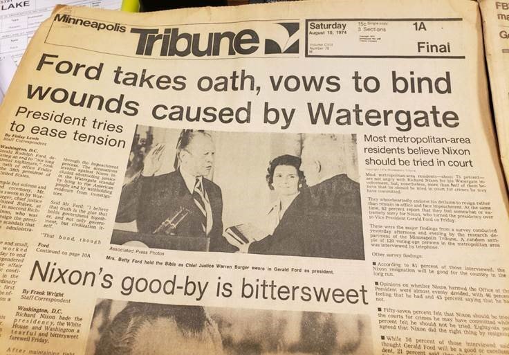 StarTribunePR's tweet photo. So this is happening: a mystery reader in south Minneapolis is dropping coins into @StarTribune newspaper boxes, opening them, and putting vintage newspapers behind the glass. Here's one our driver picked up yesterday. https://t.co/bdW35dFXXi