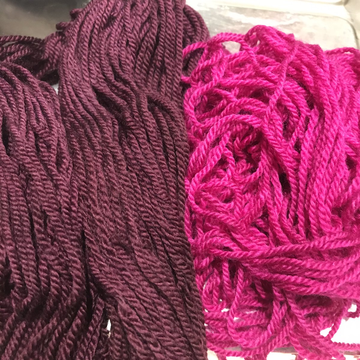 Deep plum and a rather vibrant raspberry pink just out of the dye pot!

I hand-dye when I need colour, reusing water when I can, microwaving to save gas &amp; have a renewable energy supplier. All packaging is recyclable or biodegradable. 

justwooltextiles.co.uk