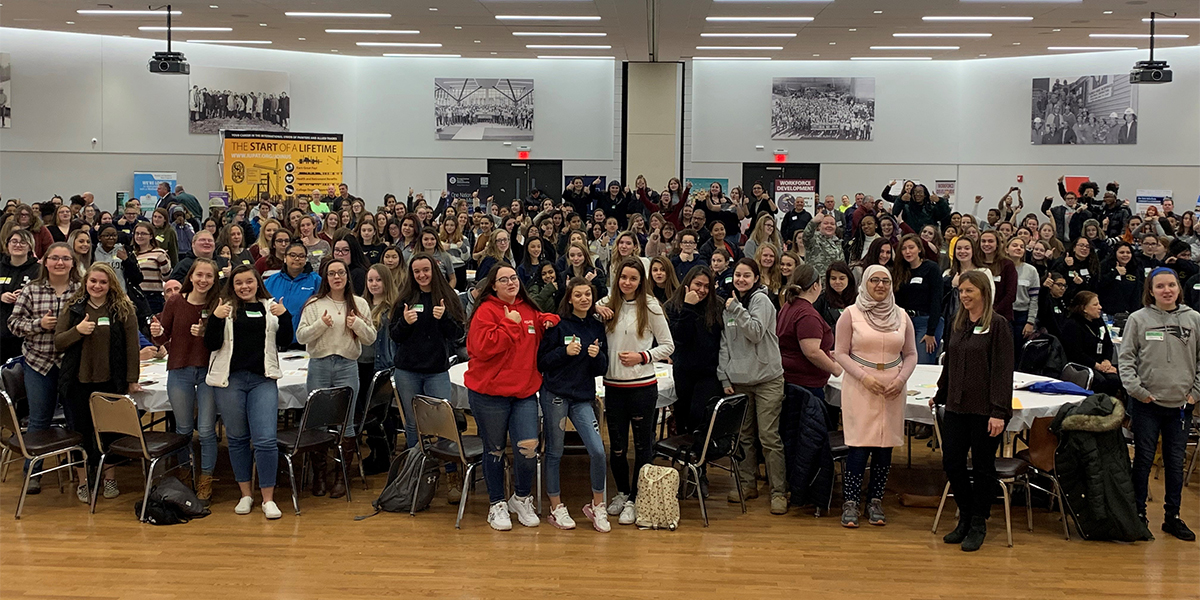 USDOL's tweet image. Women’s Bureau Deputy Director Erica Clayton Wright spoke at the Eastern Massachusetts Girls in Trades Conference and Career Fair on Wednesday for National Apprenticeship Week. Each of the 500 high school students in attendance are apprentices. #NAW2019