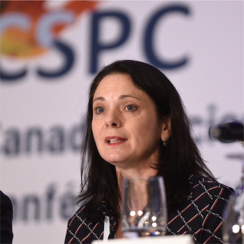 Portrait photo of a person speaking.