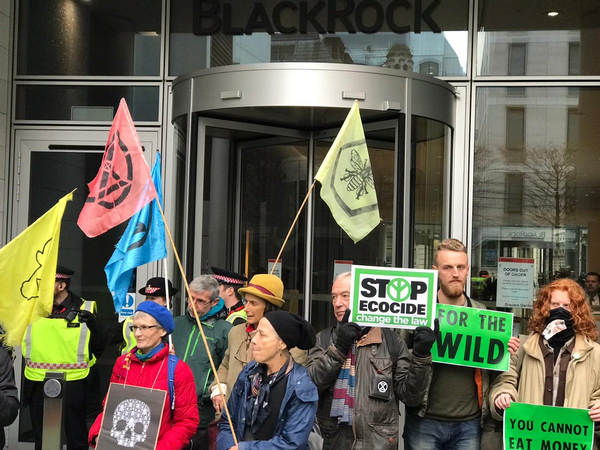 XrRebel's tweet photo. Important action taking place outside #Blackrock today. BlackRock are the world's top investor in deforestation & coal, a toxic company profiting from ecocide & the destruction of the planet.
#BoycottForAmazonia
#ExtinctionRebellion
#ClimateEmergency
#ClimateCrisis https://t.co/CQnVRd5DU4
