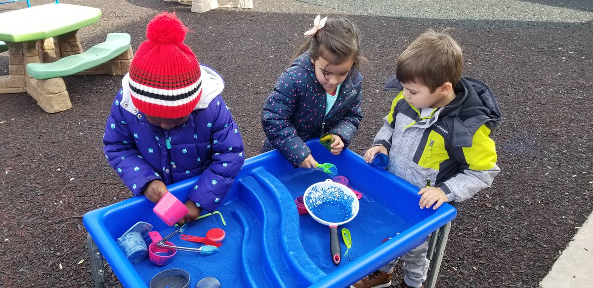 Checking out the sand table! We love scooping and pouring it! <a href="/CESMiniCougars/">Cougar Elementary</a>